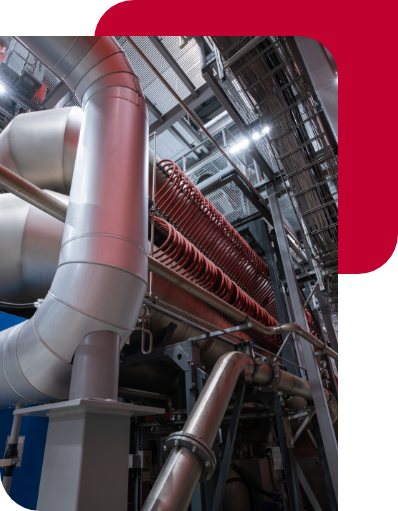 Photo of large insulated pipes in an industrial setting